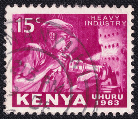 Miner with pneumatic drill on a 1963 Kenya postage stamp. Independence Series.