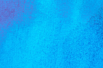 artistic backdrop: close up of canvas texture stained with bright blue paint
