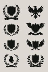 Golden vintage heraldic shield set with crown, wreath, and ribbon decorations, perfect for emblems, labels, and coat of arms illustrations