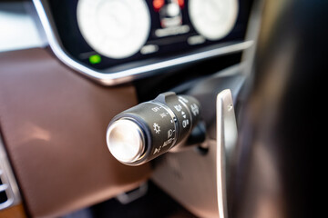 This CloseUp view of a Modern Car Control Lever shows Dashboard Indicators that highlight...