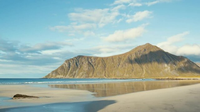 Scenic beach with a mountain reflecting in the water