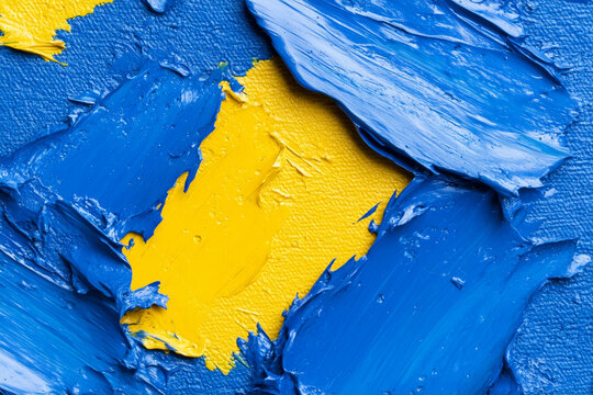 Abstract chaos of blue and yellow paint strokes on canvas