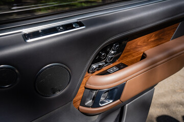 Step into the luxurious interior of a premium vehicle door, where you will find highquality wood...