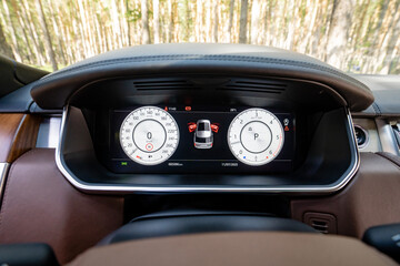 The luxury car dashboard boasts a sleek, modern design complemented by advanced features that enhance both its functionality and aesthetic appeal, providing an enjoyable driving experience