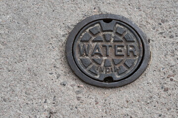Water access port in roadway. Made in India.