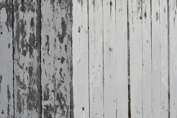 Corner of older white picket fence.
