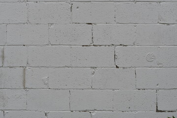 Crack that follows mortar in cinder brick wall.