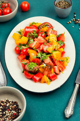 Fresh organic mixed salad with multi-colored tomatoes.