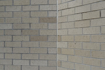 Curved brick wall. Light colored bricks.