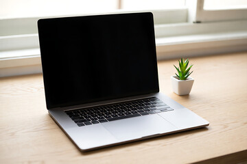 Fototapeta premium Laptop on Desk with Plant Modern Workspace Technology and Lifestyle
