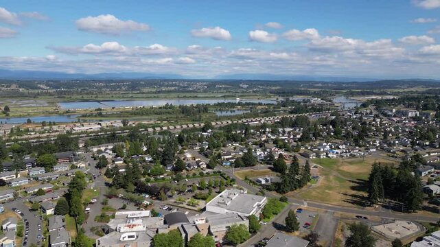 Drone Everett Washington overlooking neighborhoods and snohomish river looking  SE