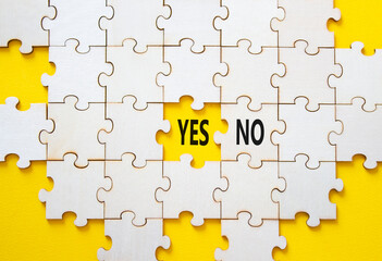 Yes or No symbol. Concept word Yes or No on wooden puzzle. Beautiful yellow background. Business...