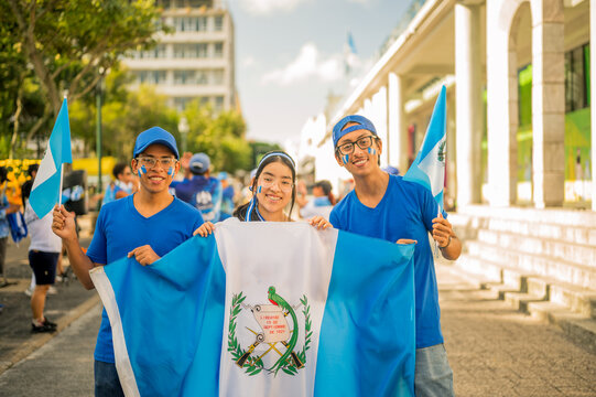 Group portraits of Latino friends celebrating Guatemala's independence celebrations. - Powered by Adobe