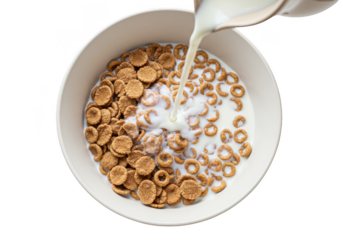 Pouring milk over cereal in a white bowl, breakfast meal with round and disc shaped pieces cereal mix on transparent background