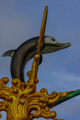 Light pole with a dolphin statue at Sunset Blue hour in Patong in the island of Phuket Thailand 