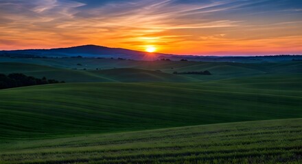  Rolling hills under a colorful sunset.jpg