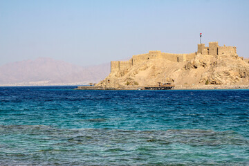 Seascape with ancient castle of Salah ad-Din on Faroun Island in Gulf of Aqaba in Red Sea. Old...