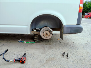Bus with a shot rear wheel for repair