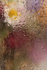 Smoke soft focus  flower bouquet through glass with wet water drops. Abstract natural blur...