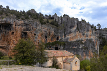 Small hermitage located in a beautiful natural environment under a large rocky mountain in soria, spain
