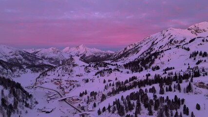 Aerial view of pastel sunrise sky over snow-covered Obertauern village - Powered by Adobe