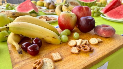 Colorful Summer Fruit and Snack Table Outdoors for a Fresh and Healthy Gathering