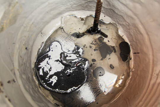 Bubbles forming at the bottom of a glass as water drains away during a warm afternoon in a cozy cafe - Powered by Adobe