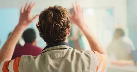 University, student or hands raised with answer in lecture for feedback, participation or learning. Professor, education or back of man with question in tutorial for assessment, curious or engagement