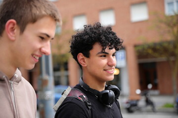 Two teenager boy walking, race diversity, students portrait