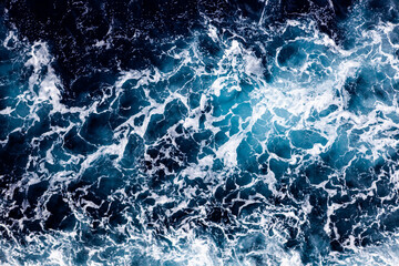 Sea surface texture. Aerial view of beautiful water with foam. Can be used in covers, packaging,...