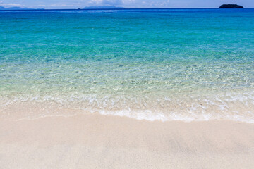Koh Adang, Thailand. Turquoise Andaman sea meets sandy beach. Beautiful tropical sea landscape. Meets sandy beach. Tranquil tropical sea landscape.