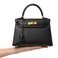 woman hand holding black luxury handbag on Isolated transparent background png. generated with AI
