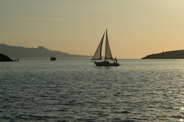 A beautiful photo of a sailboat gliding over the sea, capturing the serene waters and clear horizon...