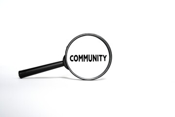The word COMMUNITY on a magnifying glass isolated on a white background.