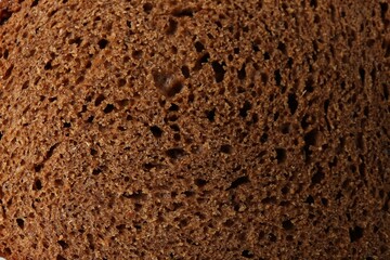 Fresh rye bread as background, closeup view