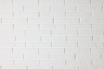 Texture of white brick wall as background, closeup