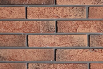 Texture of red brick wall as background, closeup