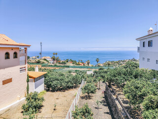 A view of a beach with a house in the background