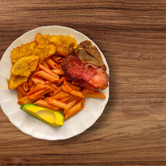 g A tasty meal, pasta, avocado, pork chop and fried plantains, from the Dominican Republic 