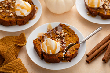 Pumpkin bread freshly baked topped with whipped cream, Thanksgiving dessert
