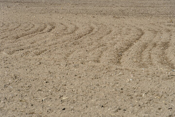 A freshly plowed agricultural field. Preparation of the soil for sowing wheat.