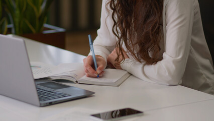 Thoughtful pensive businesswoman Caucasian girl business lady woman millennial thinking female employer writer planner ponder think idea in office planning write tasks notebook smiling studying class