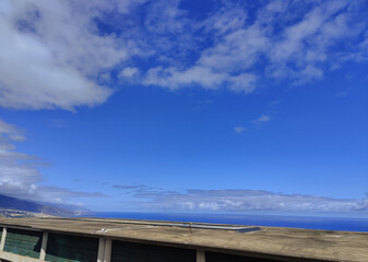 A clear blue sky with a few clouds