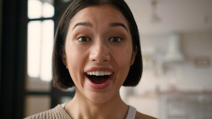 Portrait close up shocked Caucasian hispanic latin woman girl happy reaction shock emotion open...