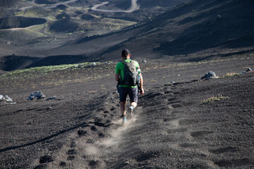 hiker trekking on mount Etna