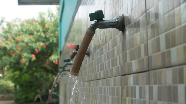 water flowing from the tap in the ablution area