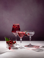 Cherry cocktail drinks with fresh cherries and elegant stemware