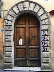 old wooden door in stone wall