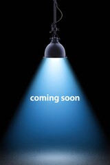 Spotlight shining on dark background with coming soon text.