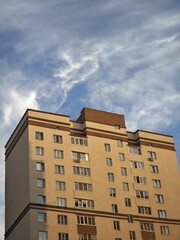 Residential building reaching for the cloudy sky